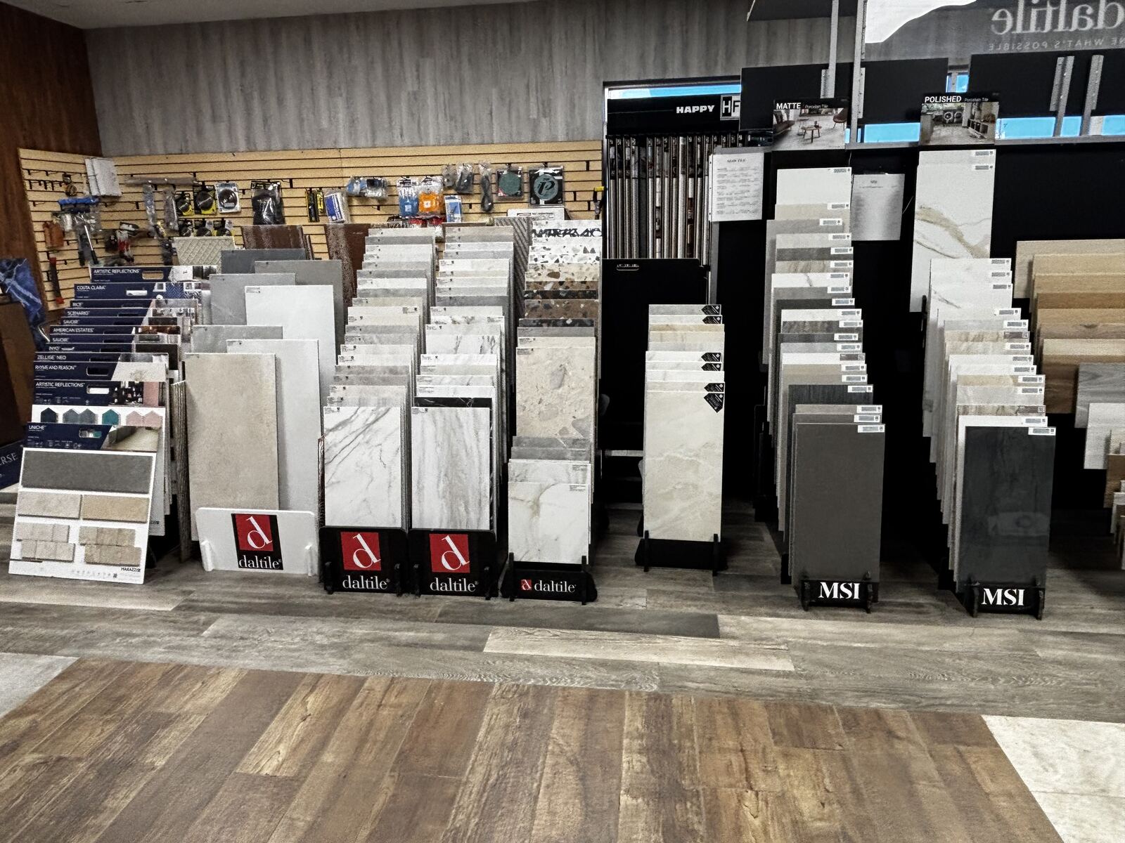 Hardwood, tile, and vinyl flooring samples in the showroom